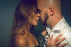 Beautiful young lovely couple hugging and kissing in studio royalty free stock images Beautiful young lovely couple hugging and kissing in studio royalty free stock images