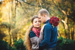 Beautiful young loving couple walking outdoors at the park. Royalty Free Stock Images Beautiful young loving couple walking outdoors at the park. Royalty Free Stock Images