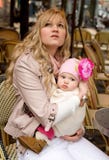 Beautiful young mother with her baby daughter stock photos Beautiful young mother with her baby daughter stock photos