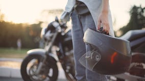 Beautiful Young Red-haired Woman Motorcyclist With Black Motorcycle Helmet Stock Photography
