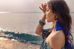 Beautiful young stylish woman in blue skirt on the beach Royalty Free Stock Photos Beautiful young stylish woman in blue skirt on the beach Royalty Free Stock Photos