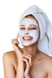 Beautiful young woman applying facial mask on her face. Skin care and treatment, spa, natural beauty and cosmetology concept, stock photos Beautiful young woman applying facial mask on her face. Skin care and treatment, spa, natural beauty and cosmetology concept, stock photos