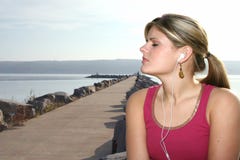 Beautiful Young Woman At Park Listening To Music Stock Photography