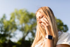 Beautiful young woman with blonde hair using mobile phone outdoor. Stylish girl making selfie stock photo Beautiful young woman with blonde hair using mobile phone outdoor. Stylish girl making selfie stock photo