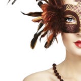 Beautiful young woman in brown venetian mask stock photo Beautiful young woman in brown venetian mask stock photo