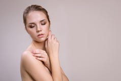 Beautiful young woman with clean fresh skin. Facial treatment stock photo Beautiful young woman with clean fresh skin. Facial treatment stock photo