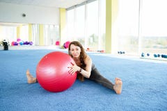 Beautiful young woman with fitness ball training in gym . concept of healthy lifestyle royalty free stock image Beautiful young woman with fitness ball training in gym . concept of healthy lifestyle royalty free stock image