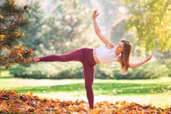 Beautiful Young Woman Practicing Yoga In The Park Stock Photography Beautiful Young Woman Practicing Yoga In The Park Stock Photography