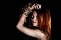 Beautiful young woman with tied arms royalty free stock photo Beautiful young woman with tied arms royalty free stock photo