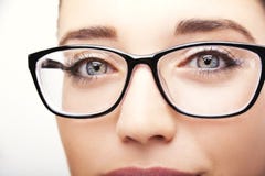 Beautiful Young Woman Wearing Glasses Close-up On White Background. Stock Photo