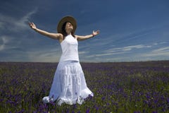 Beautiful young woman in white dress with arms wide open stock photo Beautiful young woman in white dress with arms wide open stock photo