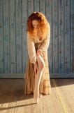 Beautifully sensual girl with long cascading wavy red hair with stockings royalty free stock photography Beautifully sensual girl with long cascading wavy red hair with stockings royalty free stock photography