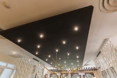 Beautifuul Closeup View Of Interior Stylish Modern Electrical Ceiling Lights On Black Panel Stock Images