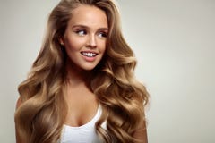 Beauty. Beautiful Woman With Long Blonde Curly Hair. Hairstyle royalty free stock photo Beauty. Beautiful Woman With Long Blonde Curly Hair. Hairstyle royalty free stock photo