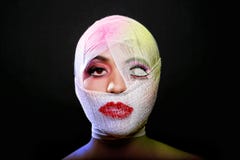 Beauty Concept of Heavy Makeup Seeping Through Gauze Stock Photos Beauty Concept of Heavy Makeup Seeping Through Gauze Stock Photos
