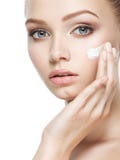 Beauty face of woman with cosmetic cream on face stock photo Beauty face of woman with cosmetic cream on face stock photo