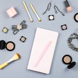 Beauty, Fashion Blogger Concept. Fashion Accessories, Note Book And Cosmetics On Grey Background Flat Lay. Stock Photo