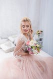 Bride in a wedding dress in the studio with a Christmas decor stock images Bride in a wedding dress in the studio with a Christmas decor stock images