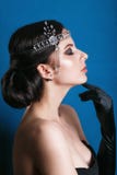Beauty fashion model retro girl over blue background. Vintage style Woman Portrait. Royalty Free Stock Images Beauty fashion model retro girl over blue background. Vintage style Woman Portrait. Royalty Free Stock Images