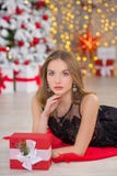 Beauty fashion woman Christmas background new year tree. Vogue style sexy girl. Gorgeous female in luxury dress at Xmas Royalty Free Stock Photography Beauty fashion woman Christmas background new year tree. Vogue style sexy girl. Gorgeous female in luxury dress at Xmas Royalty Free Stock Photography