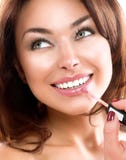 Beauty Girl Applying Lipgloss Stock Photography Beauty Girl Applying Lipgloss Stock Photography