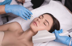 Beauty Injection. Closeup Of Doctor Hands With Syringe Near Female Face. Portrait Of Beautiful Woman Receiving Facial stock photography Beauty Injection. Closeup Of Doctor Hands With Syringe Near Female Face. Portrait Of Beautiful Woman Receiving Facial stock photography