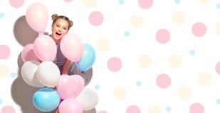 Beauty joyful teenage girl with colorful air balloons