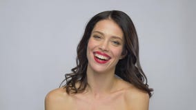 Beautiful laughing young woman with red lipstick