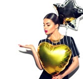 Beauty model girl with colorful balloons showing empty copy space on open hand palm stock image Beauty model girl with colorful balloons showing empty copy space on open hand palm stock image