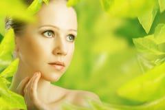 Beauty woman and a natural skin care in green