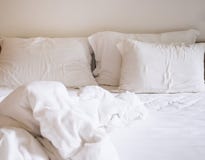 Bed sheet mattress and pillows messed up stock image Bed sheet mattress and pillows messed up stock image