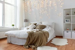 Bedroom with bed and christmas garland at home royalty free stock photos Bedroom with bed and christmas garland at home royalty free stock photos
