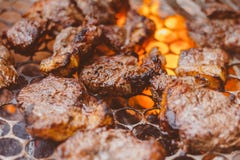 Beef being prepared on the grill. Well done steak. Delicious food stock photos Beef being prepared on the grill. Well done steak. Delicious food stock photos