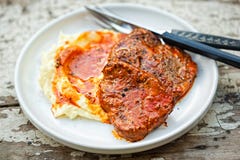 Beef steak in tomato sauce with tomato puree royalty free stock photography Beef steak in tomato sauce with tomato puree royalty free stock photography