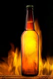 Beer Bottle In Fire On Black Stock Photos Beer Bottle In Fire On Black Stock Photos