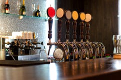 Beer taps behind a bar counter Stock Image Beer taps behind a bar counter Stock Image