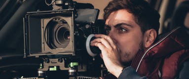 Behind the scene. Cameraman shooting film scene with his camera stock images Behind the scene. Cameraman shooting film scene with his camera stock images