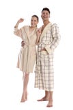 Bei giovane donna ed uomo in accappatoio fotografie stock Bei giovane donna ed uomo in accappatoio fotografie stock