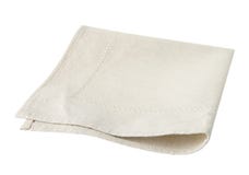 Beige geïsoleerde gevouwen keukenhanddoek Royalty-vrije Stock Fotografie Beige geïsoleerde gevouwen keukenhanddoek Royalty-vrije Stock Fotografie