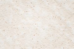 Beige recycled spotted horizontal note paper texture, light background. stock photography Beige recycled spotted horizontal note paper texture, light background. stock photography