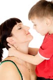 Beijo feliz da criança sua mãe imagens de stock Beijo feliz da criança sua mãe imagens de stock