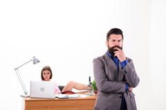Being his own boss. Boss and subordinate. Serious boss and female coworker in office. Bearded boss with pretty employee royalty free stock photo Being his own boss. Boss and subordinate. Serious boss and female coworker in office. Bearded boss with pretty employee royalty free stock photo