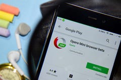 Opera Mini browser beta dev app with magnifying on Smartphone screen royalty free stock photo Opera Mini browser beta dev app with magnifying on Smartphone screen royalty free stock photo