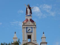 Bell Tower with Clock and Statue of Jesus on a Village Church Royalty Free Stock Photos Bell Tower with Clock and Statue of Jesus on a Village Church Royalty Free Stock Photos