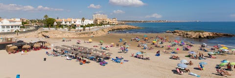Belle plage sablonneuse de Playa Cala Capitan Espagne sur la côte d'Orihuela près de la La Zenia et Playa Flamenca image stock Belle plage sablonneuse de Playa Cala Capitan Espagne sur la côte d'Orihuela près de la La Zenia et Playa Flamenca image stock