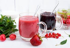 Berry Smoothie In Of Glass Cups, Yogurt, Granola, Fresh Berries On White Wooden Background Stock Photography Berry Smoothie In Of Glass Cups, Yogurt, Granola, Fresh Berries On White Wooden Background Stock Photography