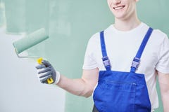 Berufsmaler mit Rolle lizenzfreie stockfotos Berufsmaler mit Rolle lizenzfreie stockfotos