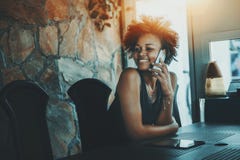 Beutiful black curly woman waiting in dark office room royalty free stock images Beutiful black curly woman waiting in dark office room royalty free stock images