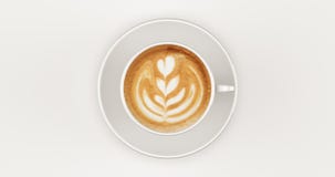 Białego filiżanki Cappuccino Odgórny widok z zawijasem obraz stock Białego filiżanki Cappuccino Odgórny widok z zawijasem obraz stock