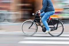 Bicycle Rider In Motion Blur Stock Photography